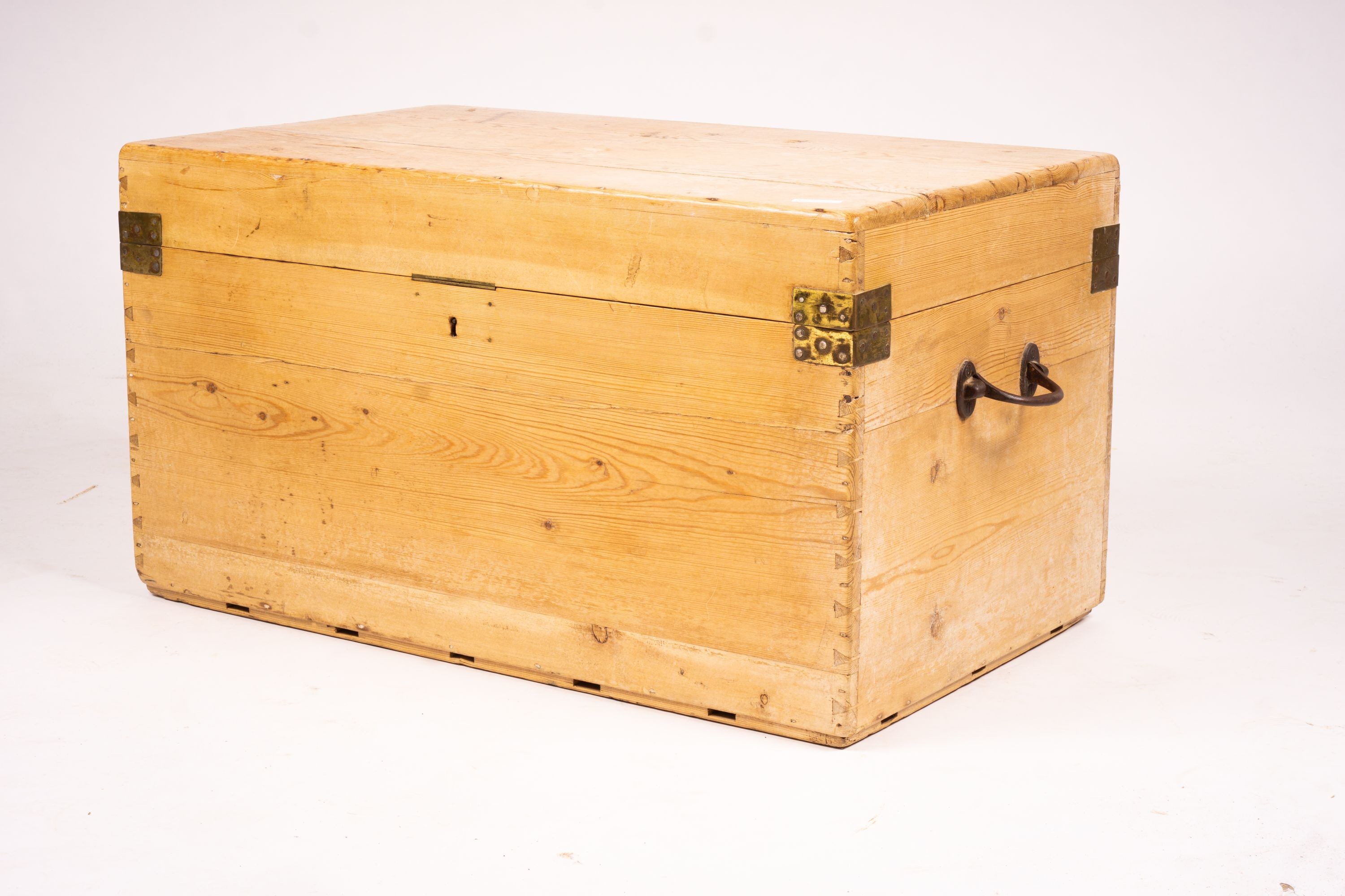 A small Victorian brass bound rectangular pine trunk, length 76cm, depth 46cm, height 42cm